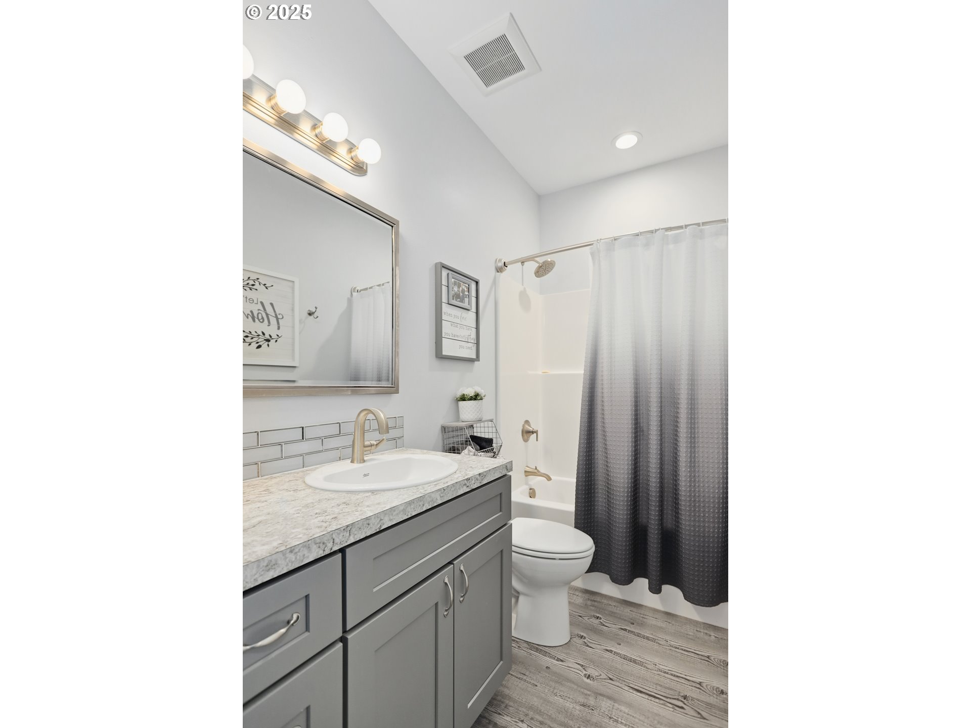 1275 Wright Road Arlington, OR 97812 - Photo 11 of 34 a bathroom with a granite countertop sink mirror vanity and toilet