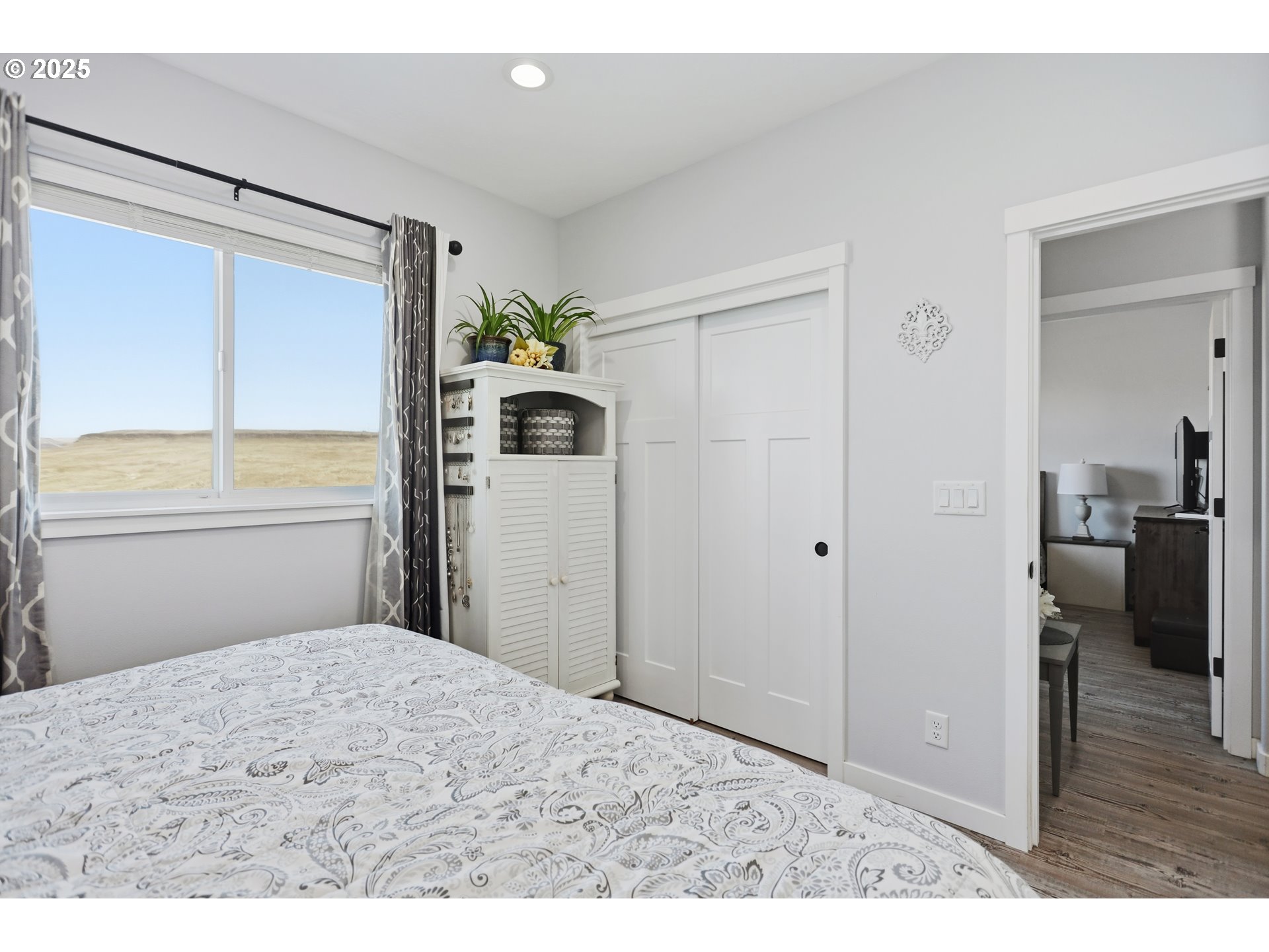 1275 Wright Road Arlington, OR 97812 - Photo 17 of 34 a view of a bedroom with wooden floor and closet