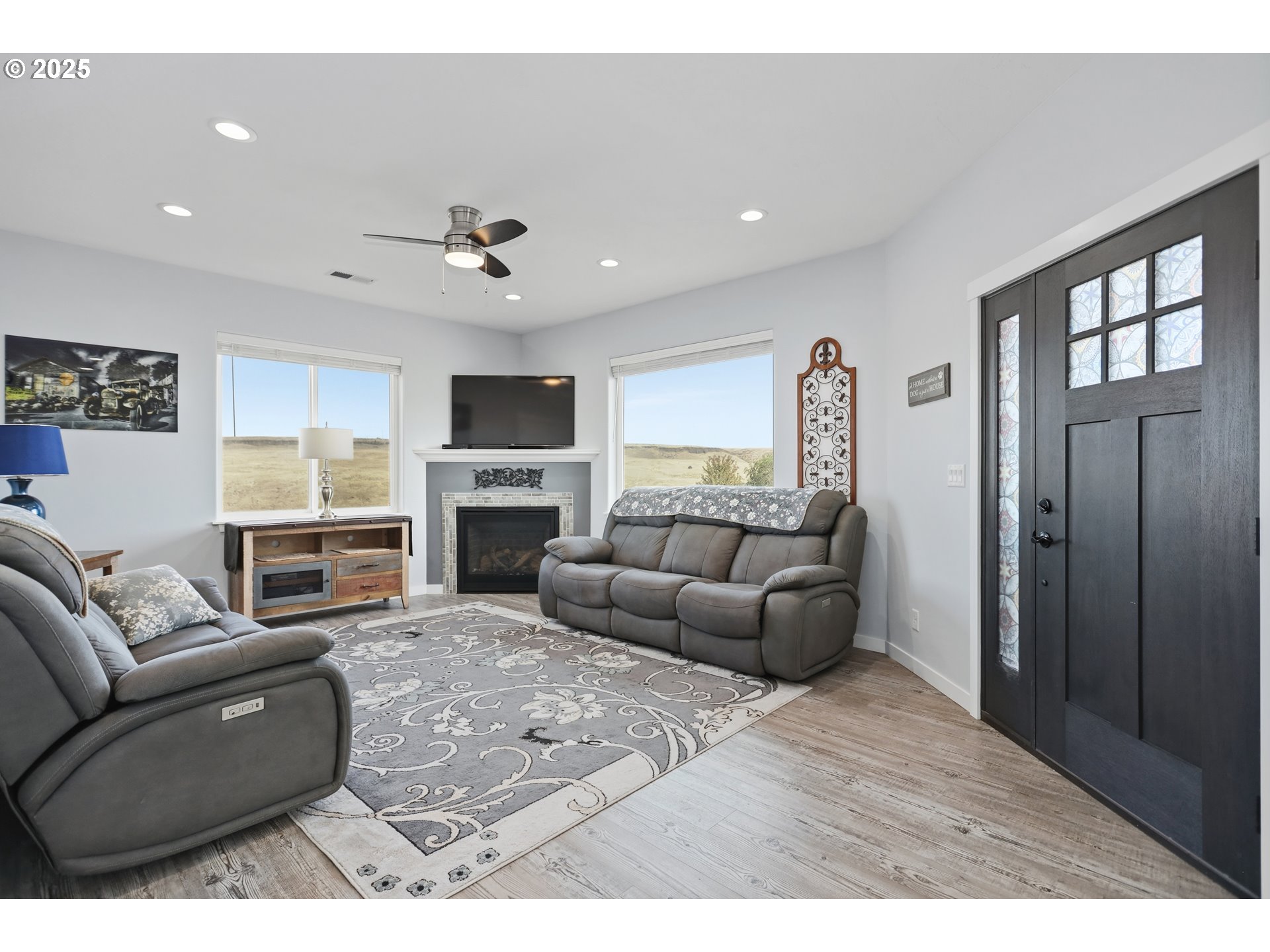1275 Wright Road Arlington, OR 97812 - Photo 19 of 34 a living room with furniture a fireplace and a flat screen tv