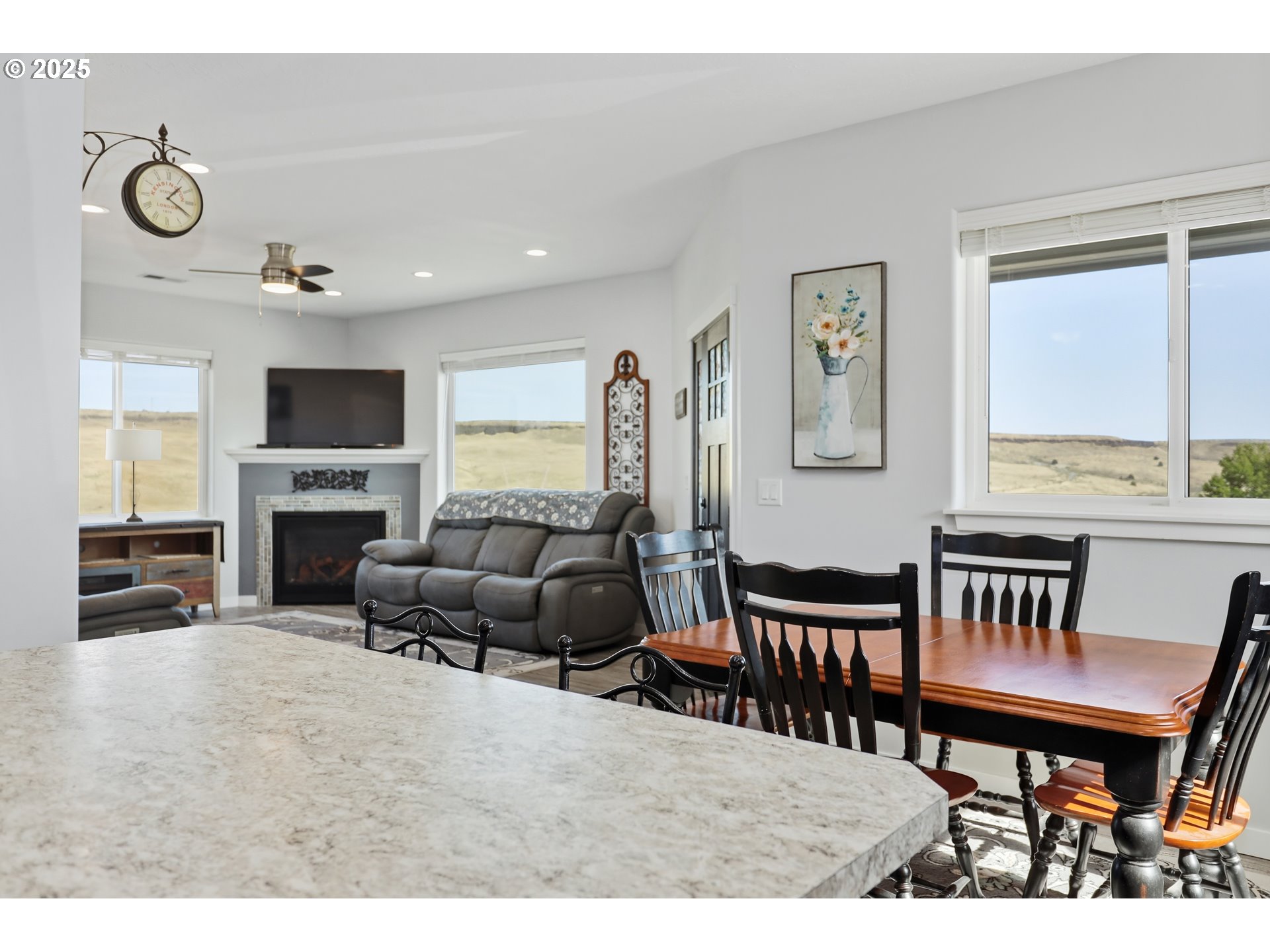 1275 Wright Road Arlington, OR 97812 - Photo 26 of 34 a living room with furniture a fireplace and a flat screen tv