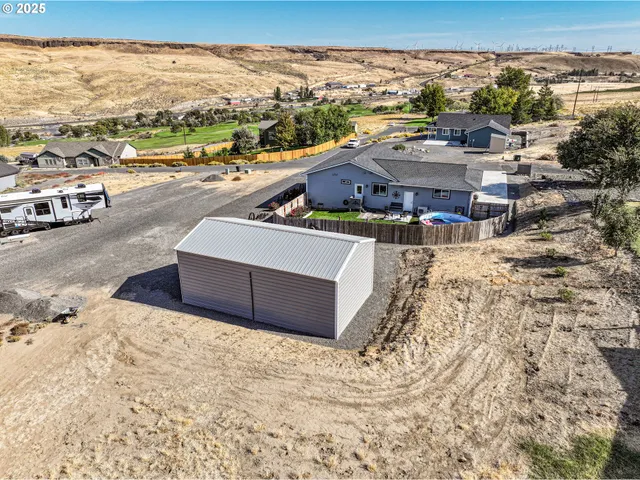 an aerial view of residential houses with outdoor space