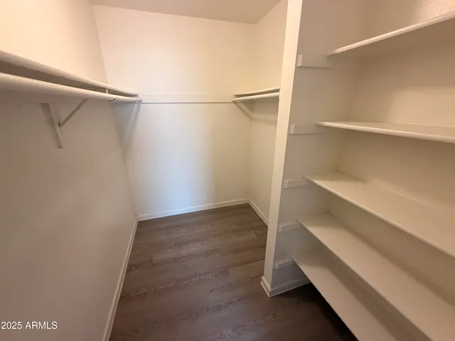 a view of an empty walk in closet