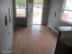 502 South Hennessy Road Yakima, WA 98908 - Photo 9 of 17 a view of hallway with window and wooden floor