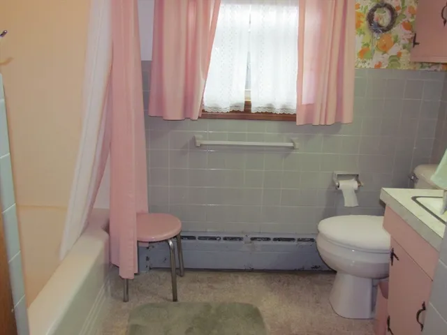a bathroom with a toilet and a sink