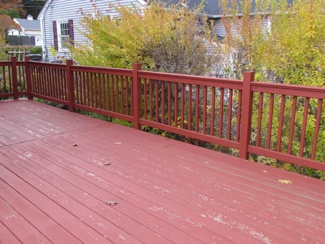 a view of a balcony with wooden floor