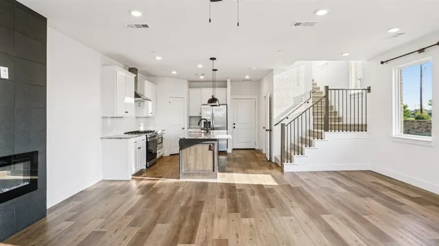 a view of kitchen with furniture and refrigerator