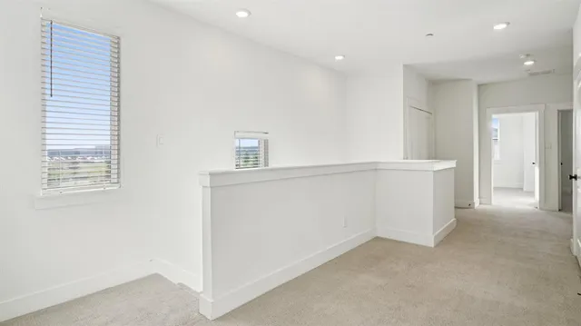 a view of a hallway with staircase