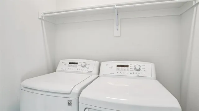 a view of a hallway with closet and a cabinet