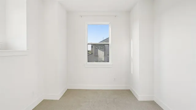 a bathroom with a shower and toilet