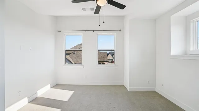 a view of empty room with windows