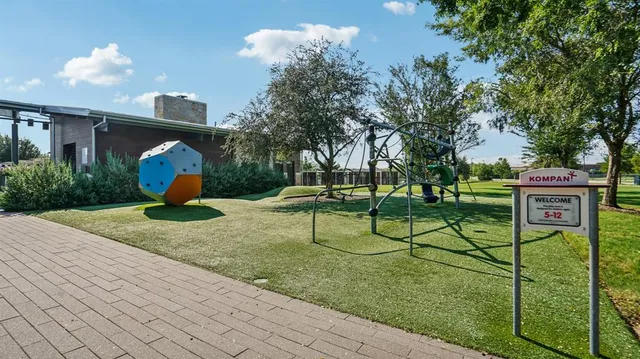 a view of a park with plants and trees