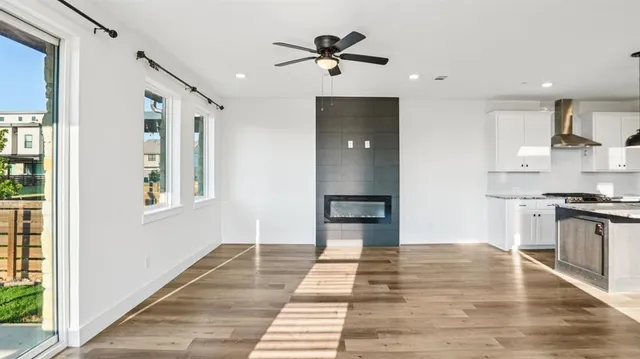a view of kitchen with sink and refrigerator