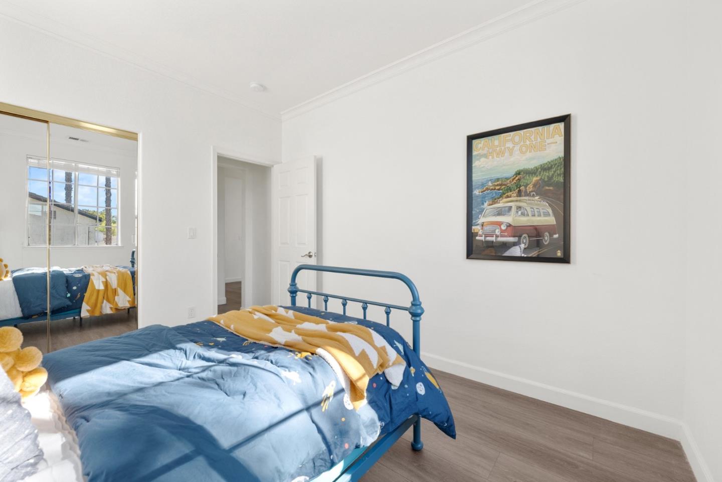 4675 La Crescent Loop San Jose, CA 95136 - Photo 14 of 22 a bedroom with a bed and wooden floor