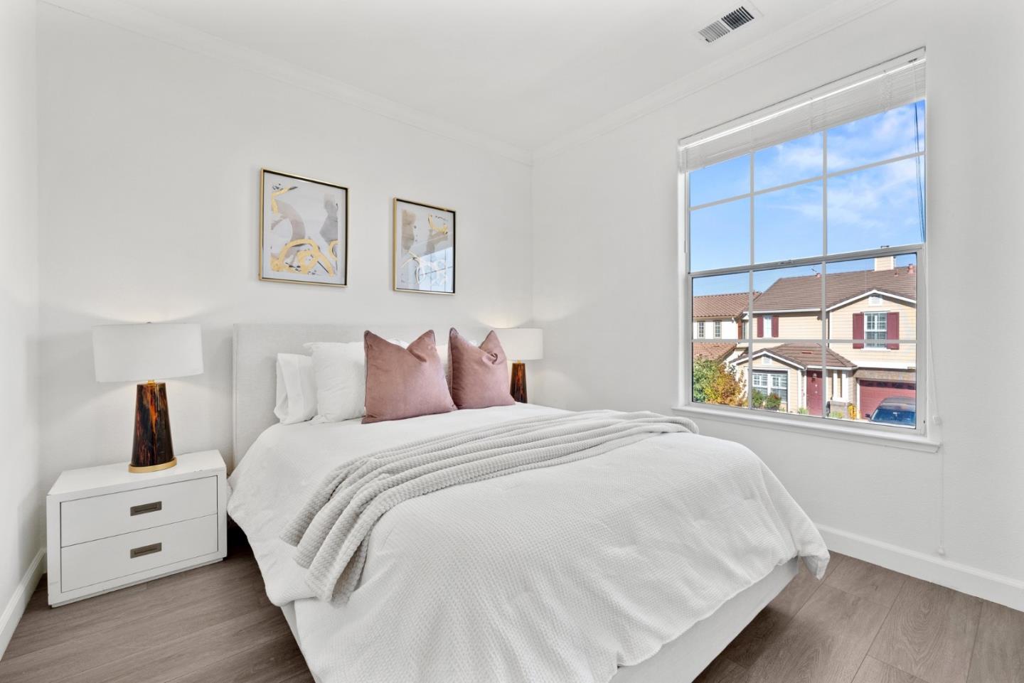 4675 La Crescent Loop San Jose, CA 95136 - Photo 17 of 22 a bedroom with a white bed and a window