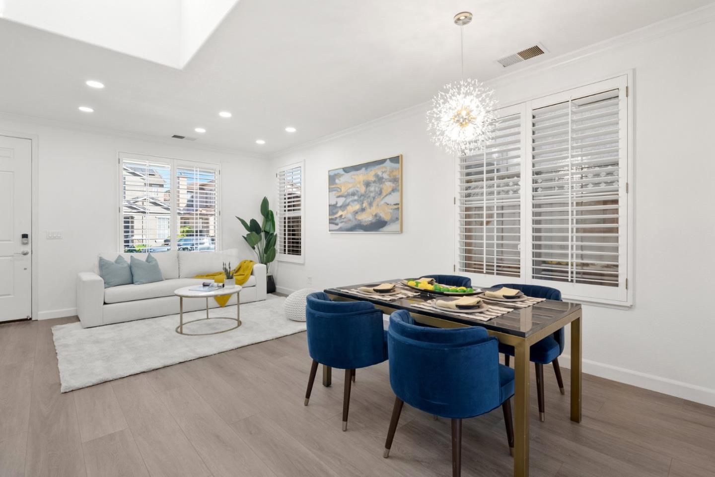 4675 La Crescent Loop San Jose, CA 95136 - Photo 3 of 22 a view of a dining room with furniture window and wooden floor