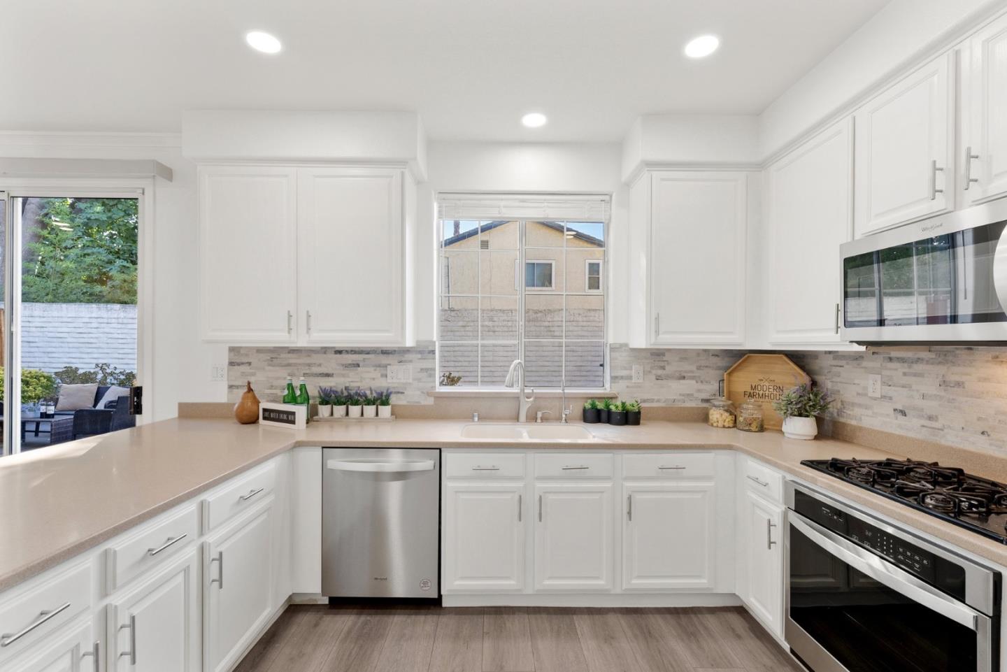 4675 La Crescent Loop San Jose, CA 95136 - Photo 8 of 22 a kitchen with a sink stove and cabinets