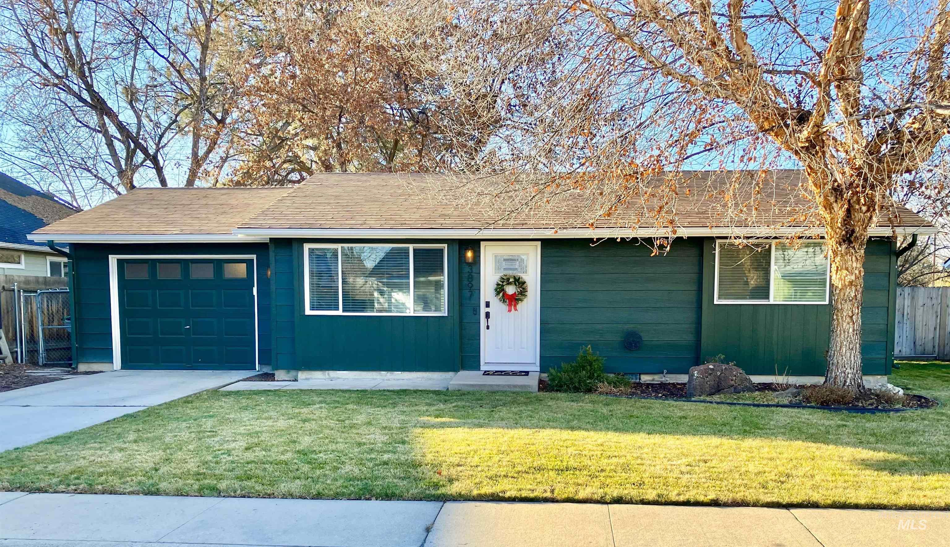 3897 South Yorktown Way Boise, ID 83706 - Photo 1 of 23 Single story home with concrete driveway, an attached garage, and a shingled roof