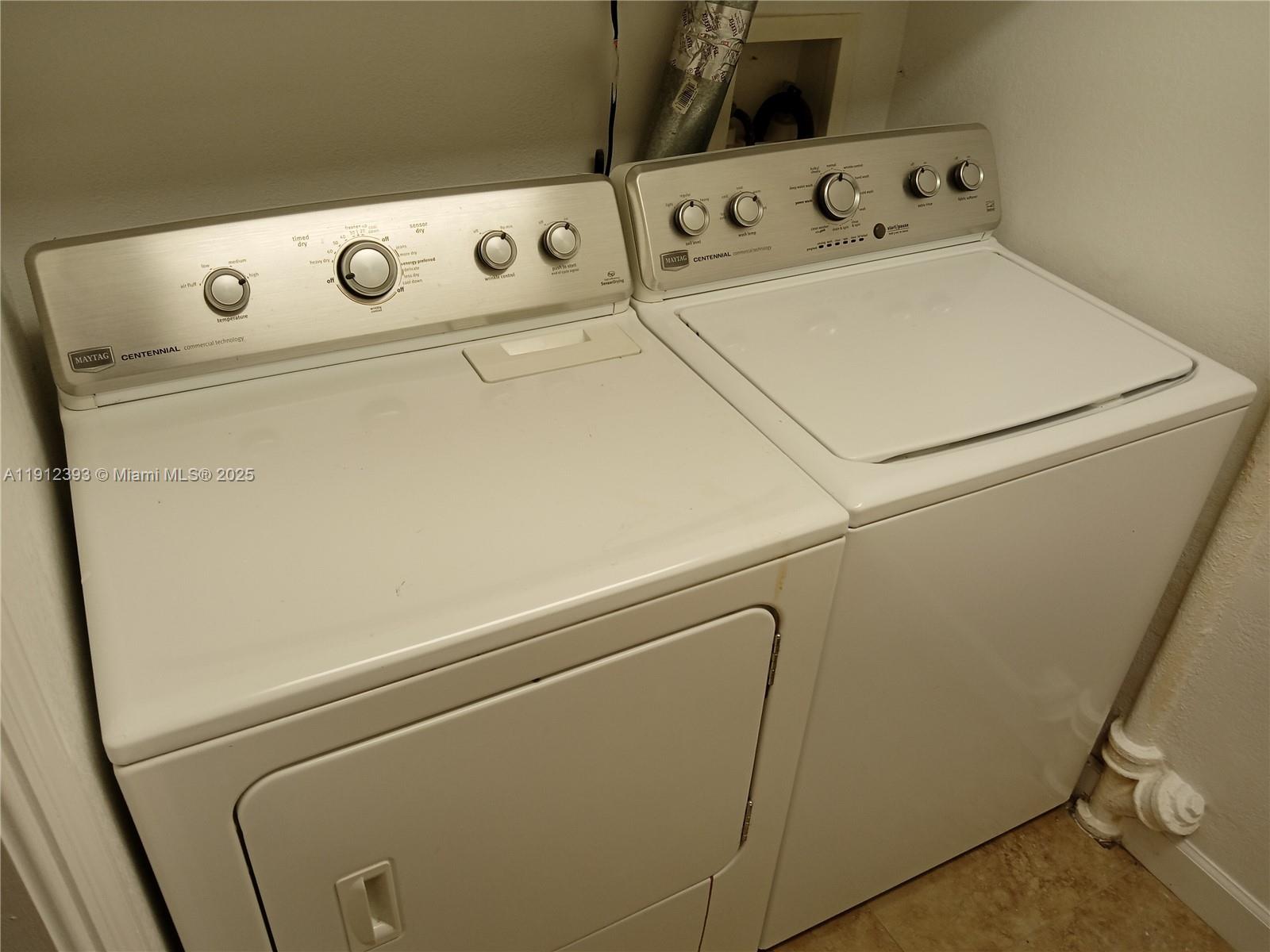 1906 Tigertail Avenue Miami, FL 33133 - Photo 14 of 17 a close up view of washer and dryer with washer