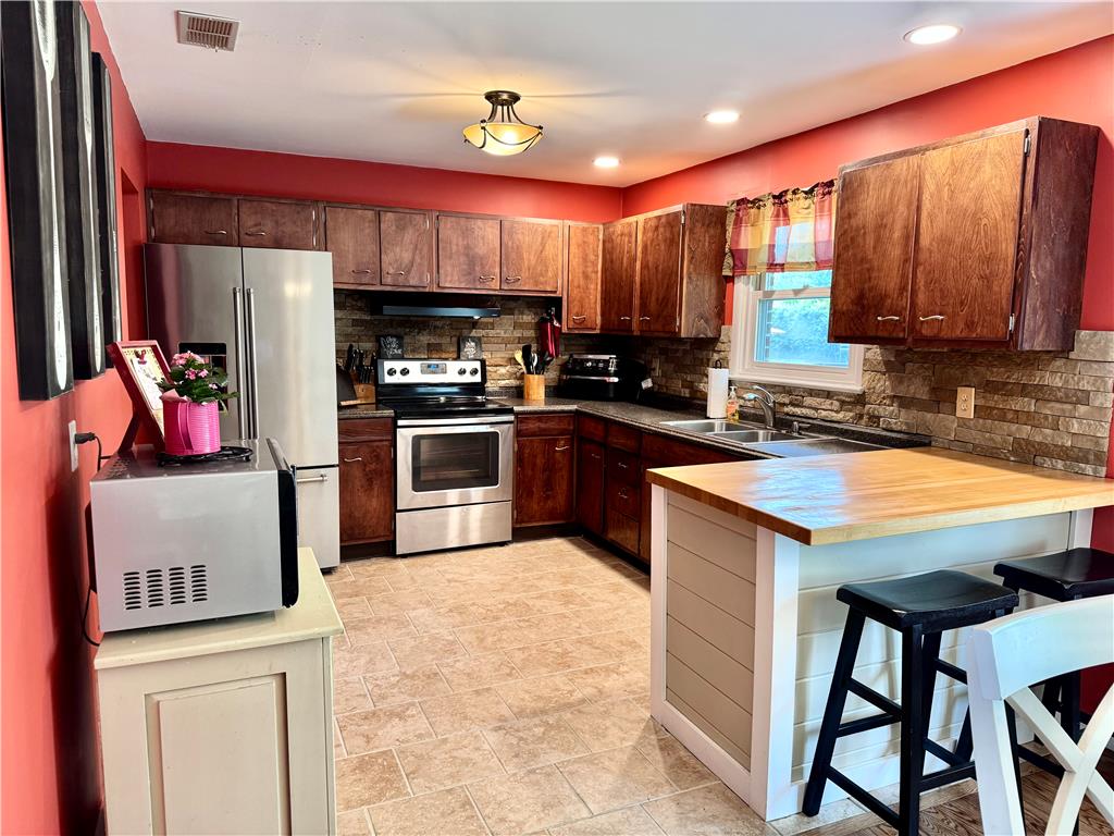 5334 Egypt Road Laurys Station, PA 18059 - Photo 14 of 55 A functional kitchen boasts stainless steel appliances, ample cabinetry, and a butcher block island.