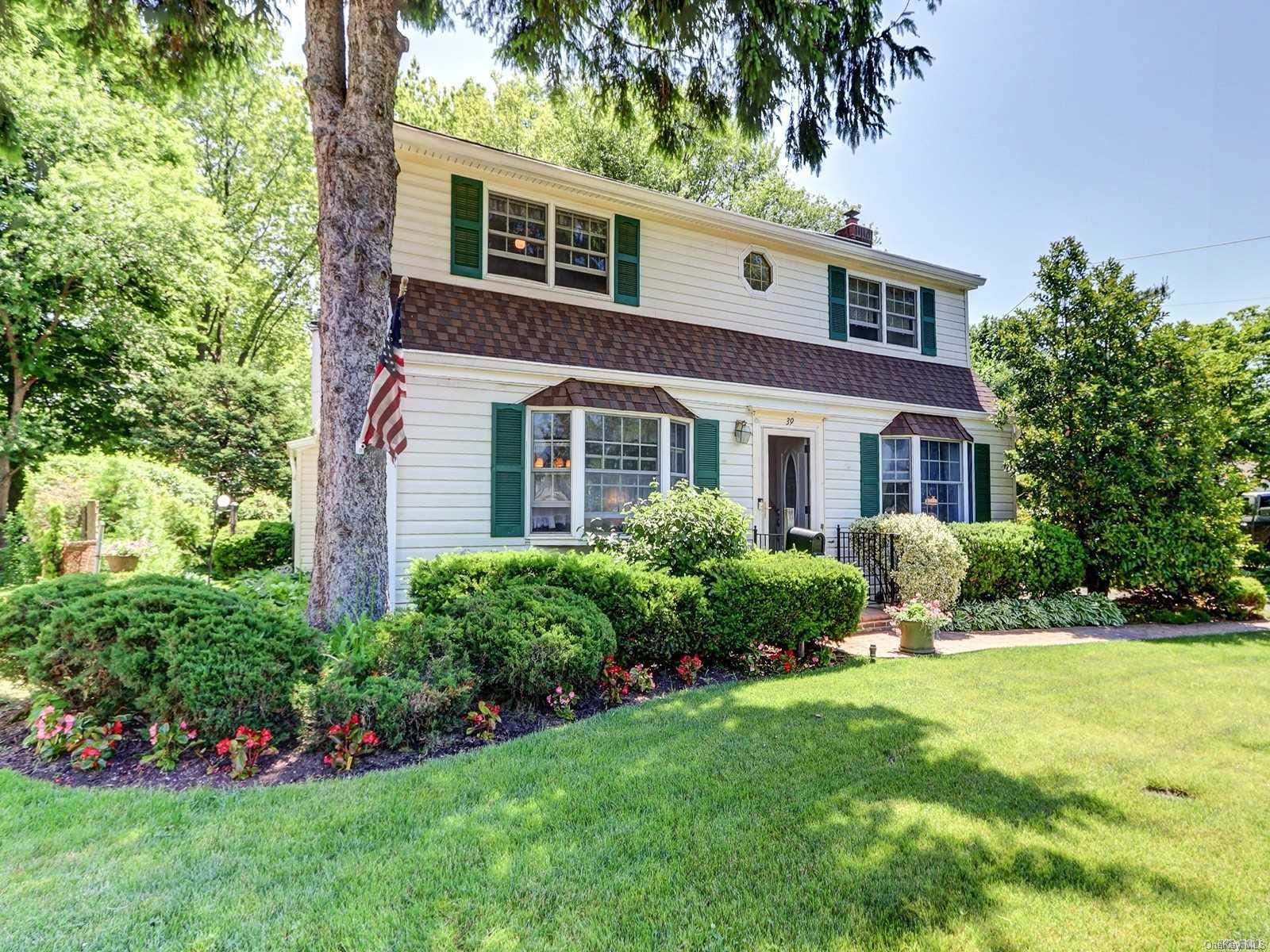 39 Gables Road Hicksville, NY 11801 - Photo 1 of 1 a front view of a house with a yard and trees