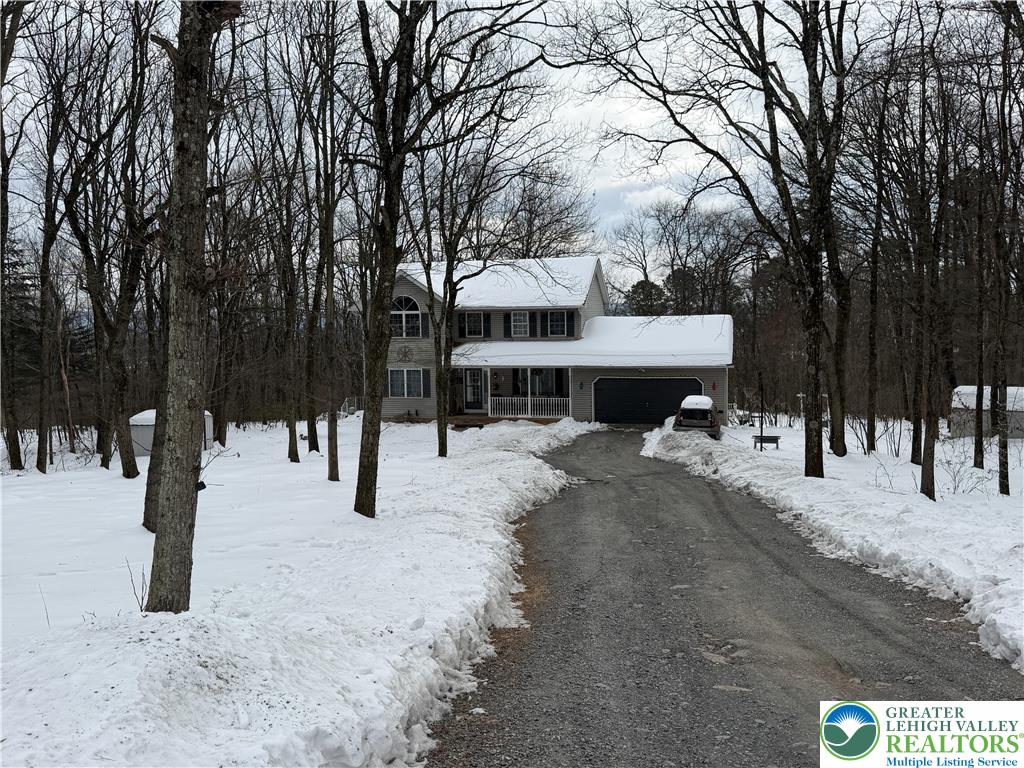 303 East Mountain Top Road Summit Hill, PA 18250 - Photo 2 of 31 a view of a house with a yard covered in snow