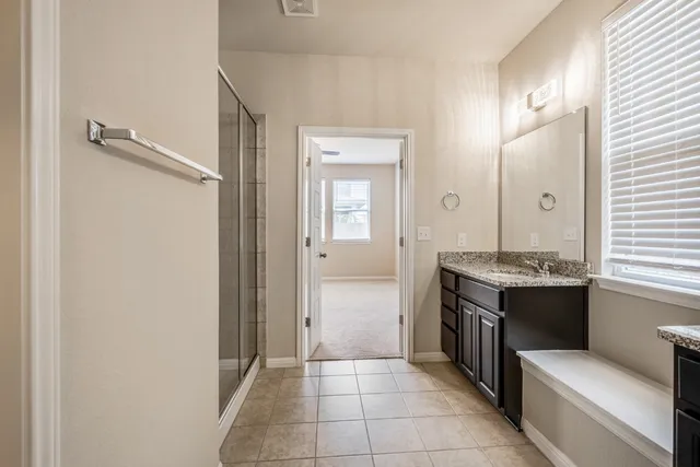 a bathroom with a sink and mirror