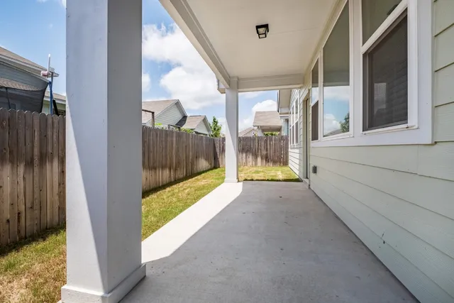 a view of porch with green space