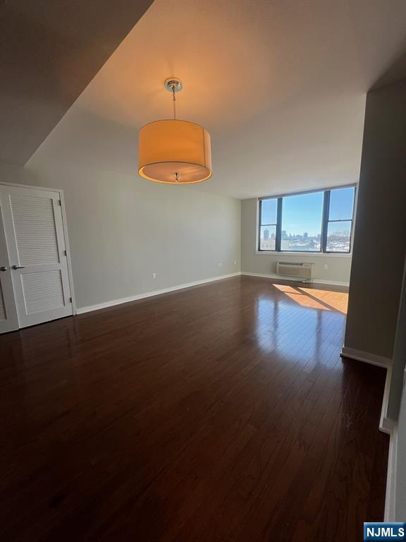 305 Palisade Avenue, Unit 208 Cliffside Park, NJ 07010 - Photo 14 of 16 a view of a livingroom with wooden floor
