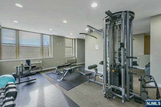 305 Palisade Avenue, Unit 208 Cliffside Park, NJ 07010 - Photo 8 of 16 a room with gym equipment and mirror