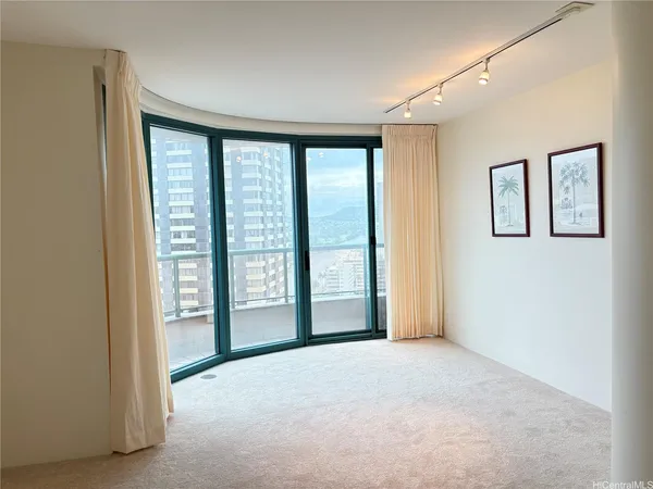 a view of an empty room with a window