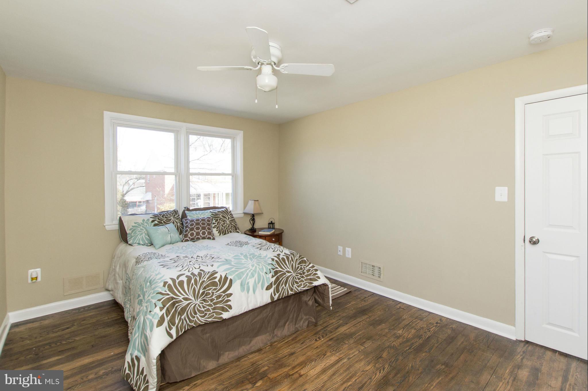 1111 Hollen Road Baltimore, MD 21239 - Photo 14 of 30 a bedroom with a bed and window