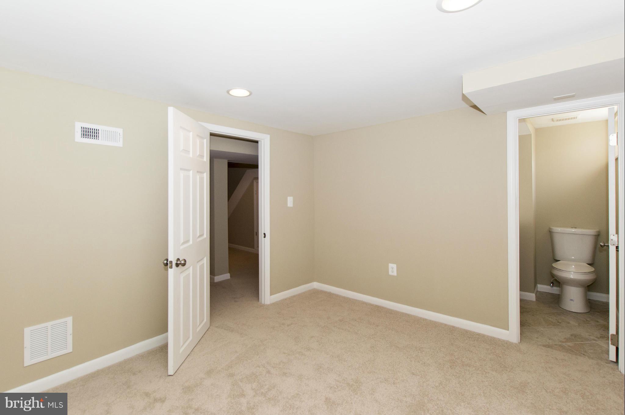 1111 Hollen Road Baltimore, MD 21239 - Photo 21 of 30 a view of a bathroom with toilet