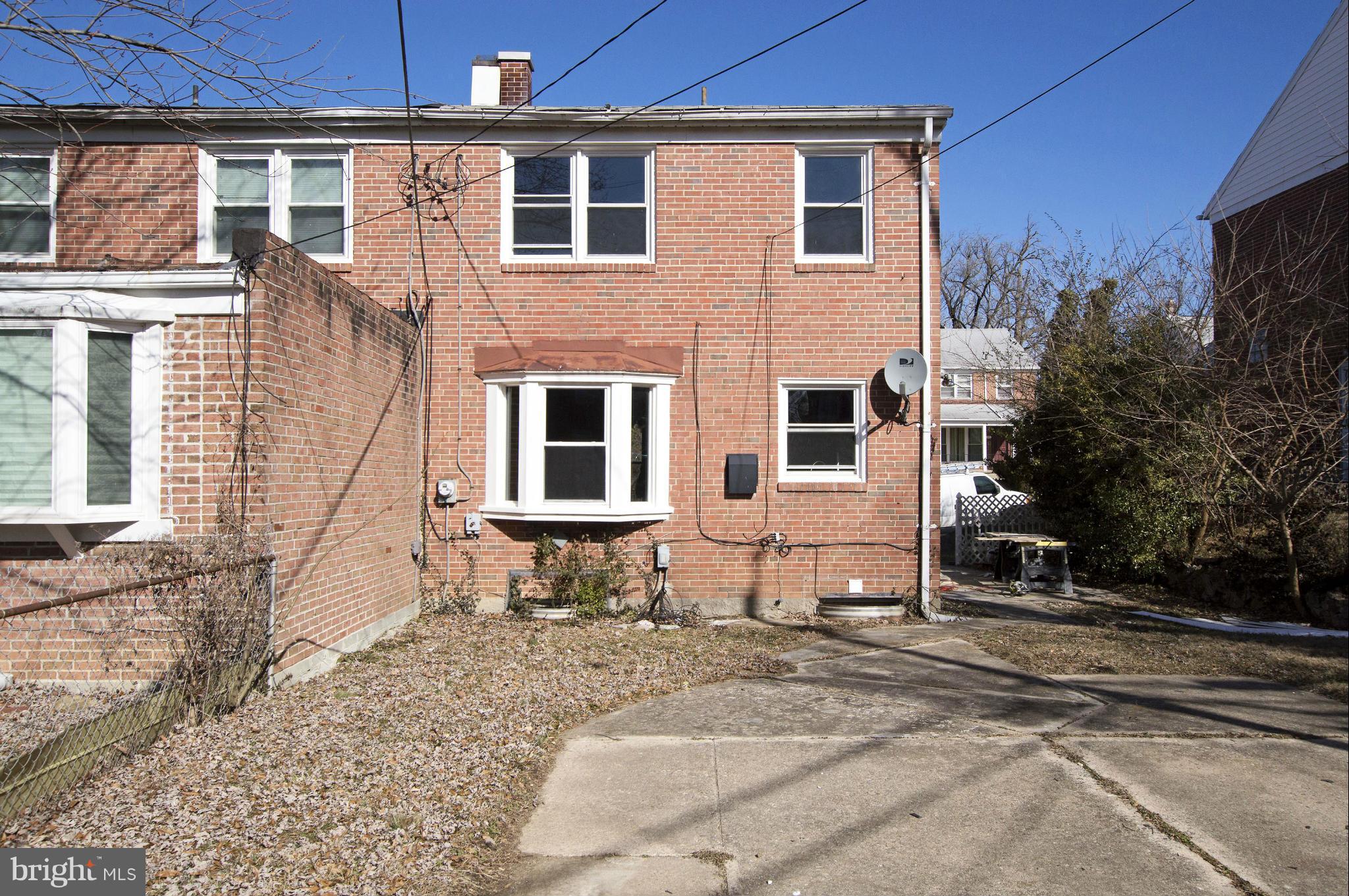1111 Hollen Road Baltimore, MD 21239 - Photo 28 of 30 a front view of a house with a yard