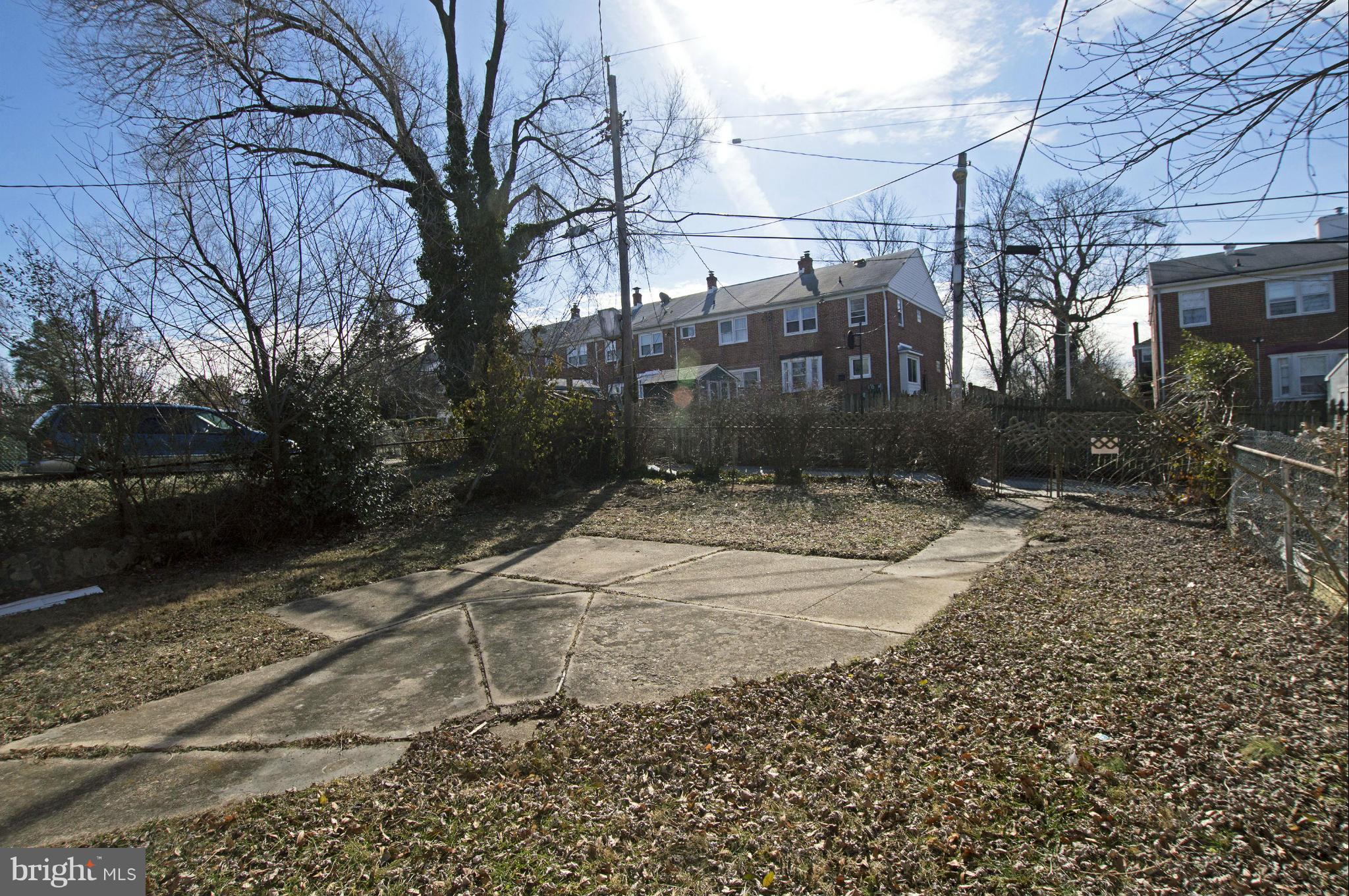 1111 Hollen Road Baltimore, MD 21239 - Photo 30 of 30 a view of a street with a bench in the yard