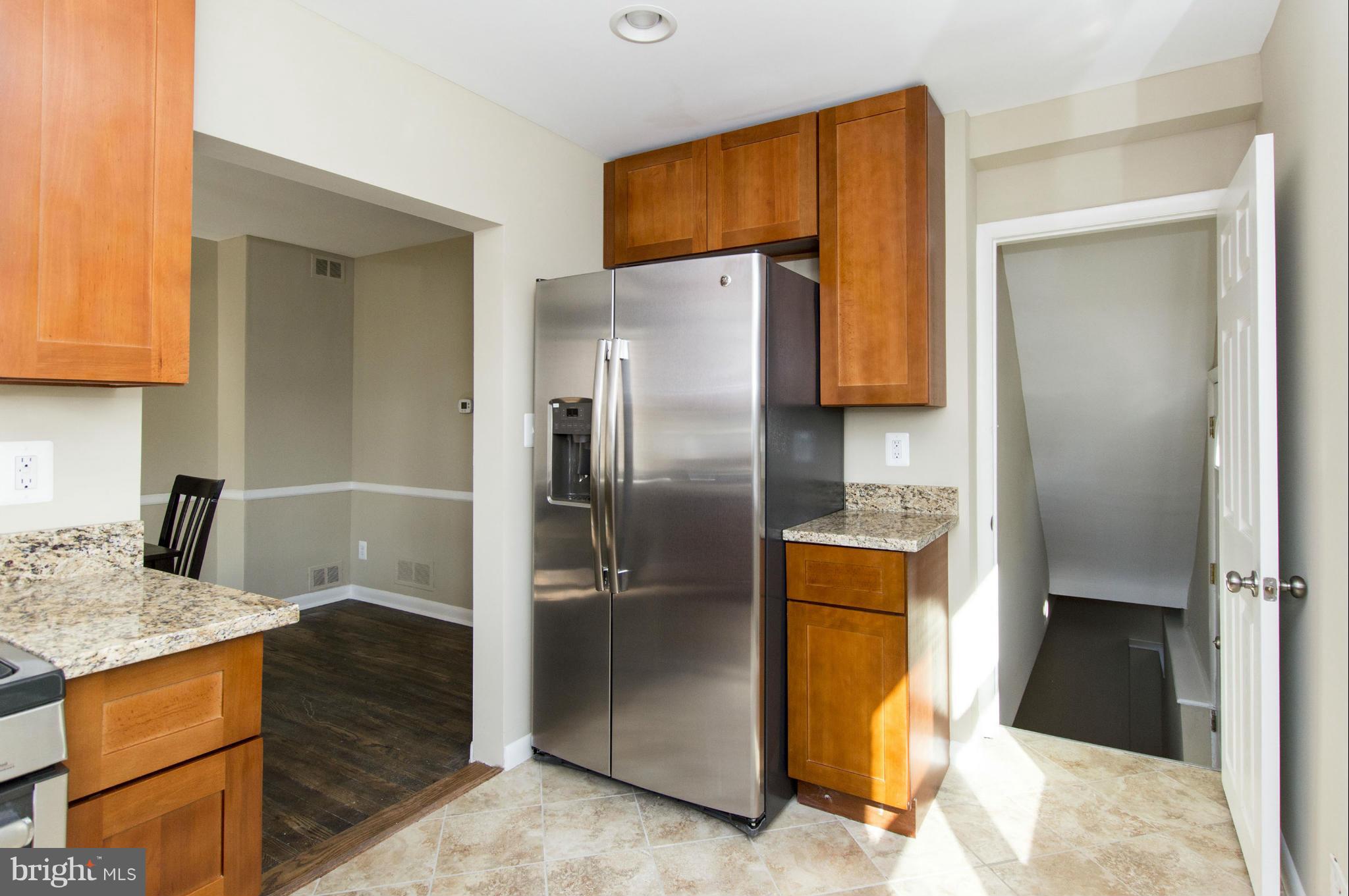 1111 Hollen Road Baltimore, MD 21239 - Photo 4 of 30 a kitchen with stainless steel appliances granite countertop a refrigerator a stove and a sink