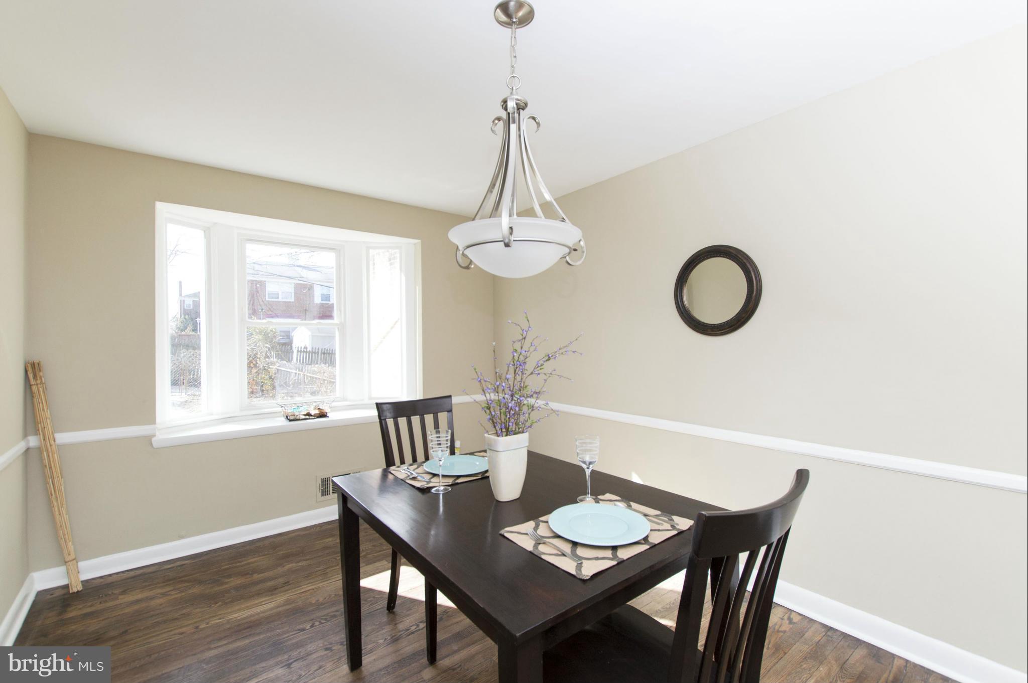 1111 Hollen Road Baltimore, MD 21239 - Photo 6 of 30 a view of a dining room with furniture window and wooden floor