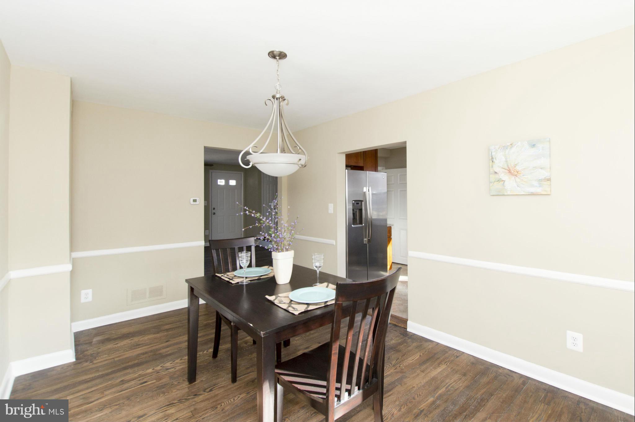 1111 Hollen Road Baltimore, MD 21239 - Photo 7 of 30 a view of a dining room with furniture and wooden floor