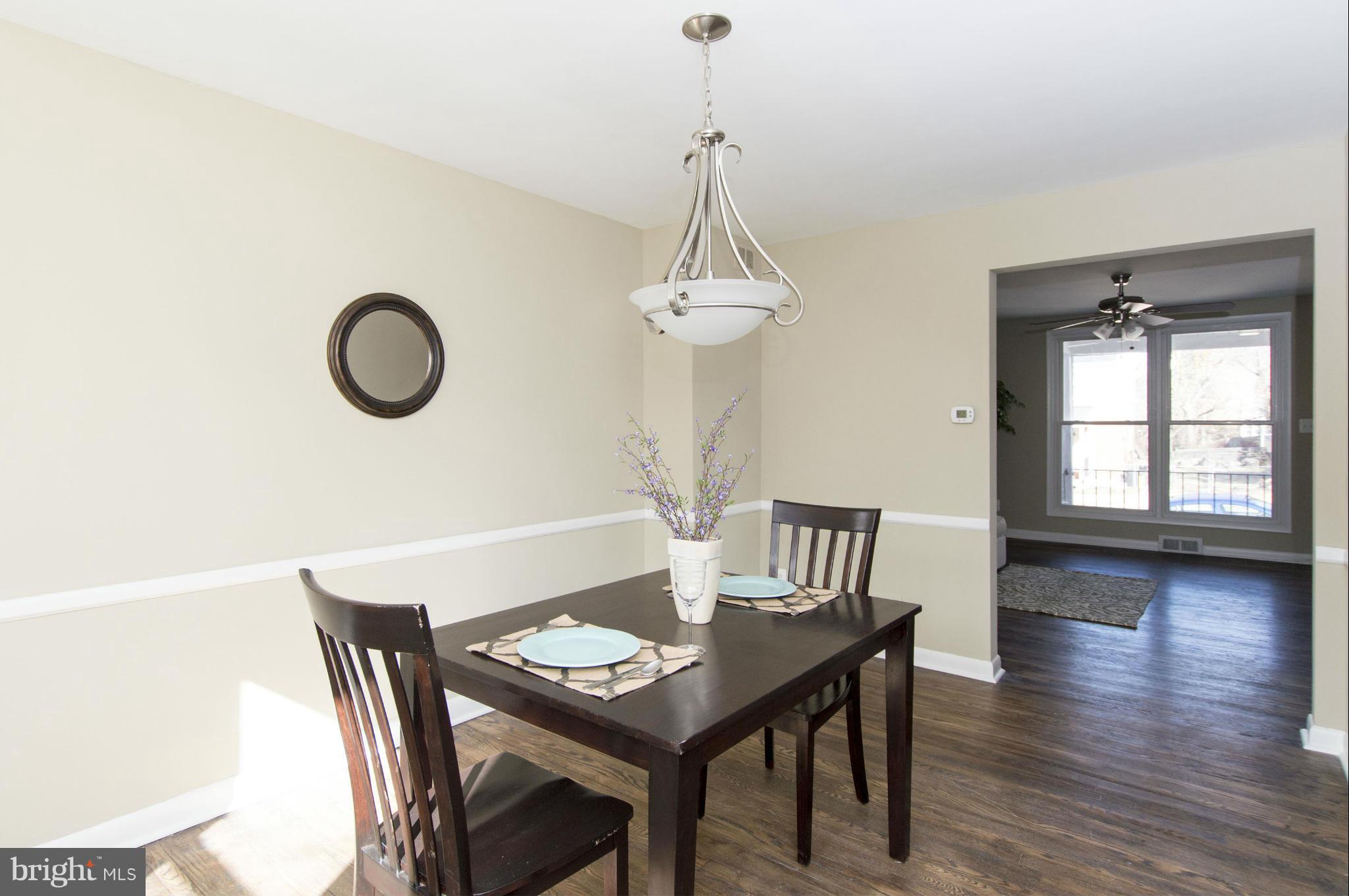 1111 Hollen Road Baltimore, MD 21239 - Photo 8 of 30 a view of a dining room with furniture and wooden floor