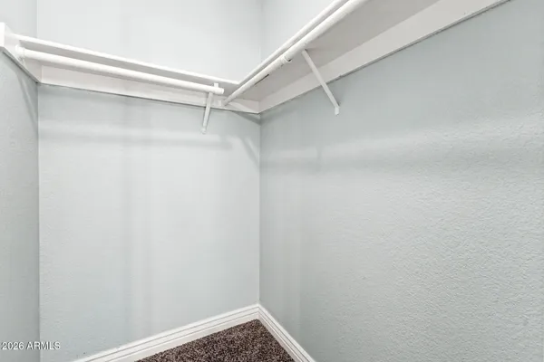 a view of an empty walk in closet