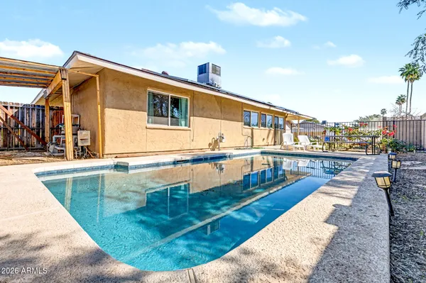 a view of a house with swimming pool