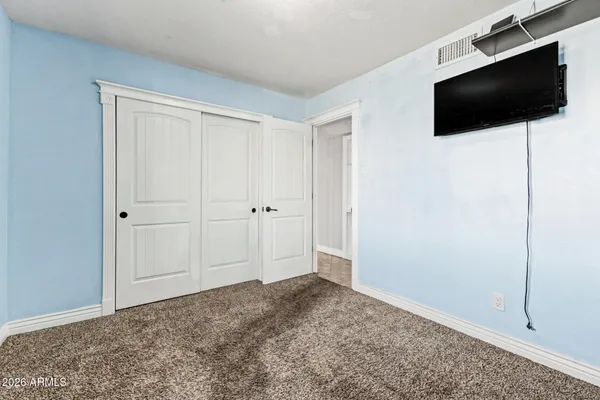 a view of a livingroom with a flat screen tv