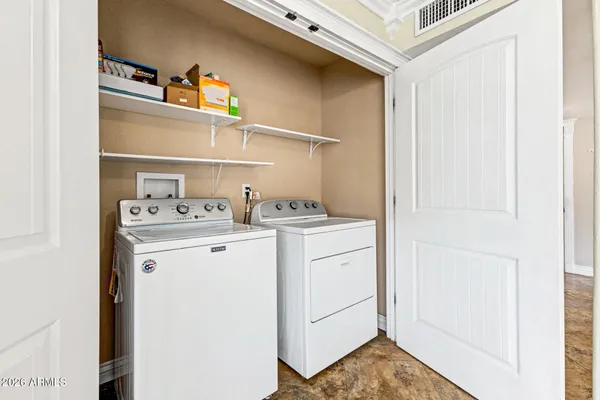 a utility room with dryer and washer