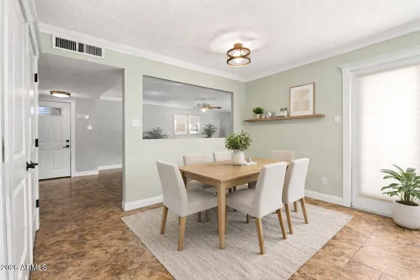 a view of a dining room with furniture and wooden floor
