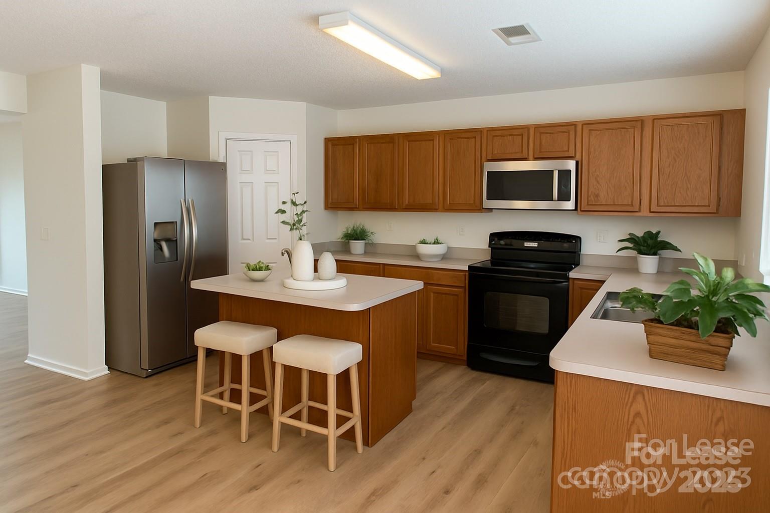 3232 Barons Court Road Charlotte, NC 28213 - Photo 3 of 11 a kitchen with a sink stove and refrigerator