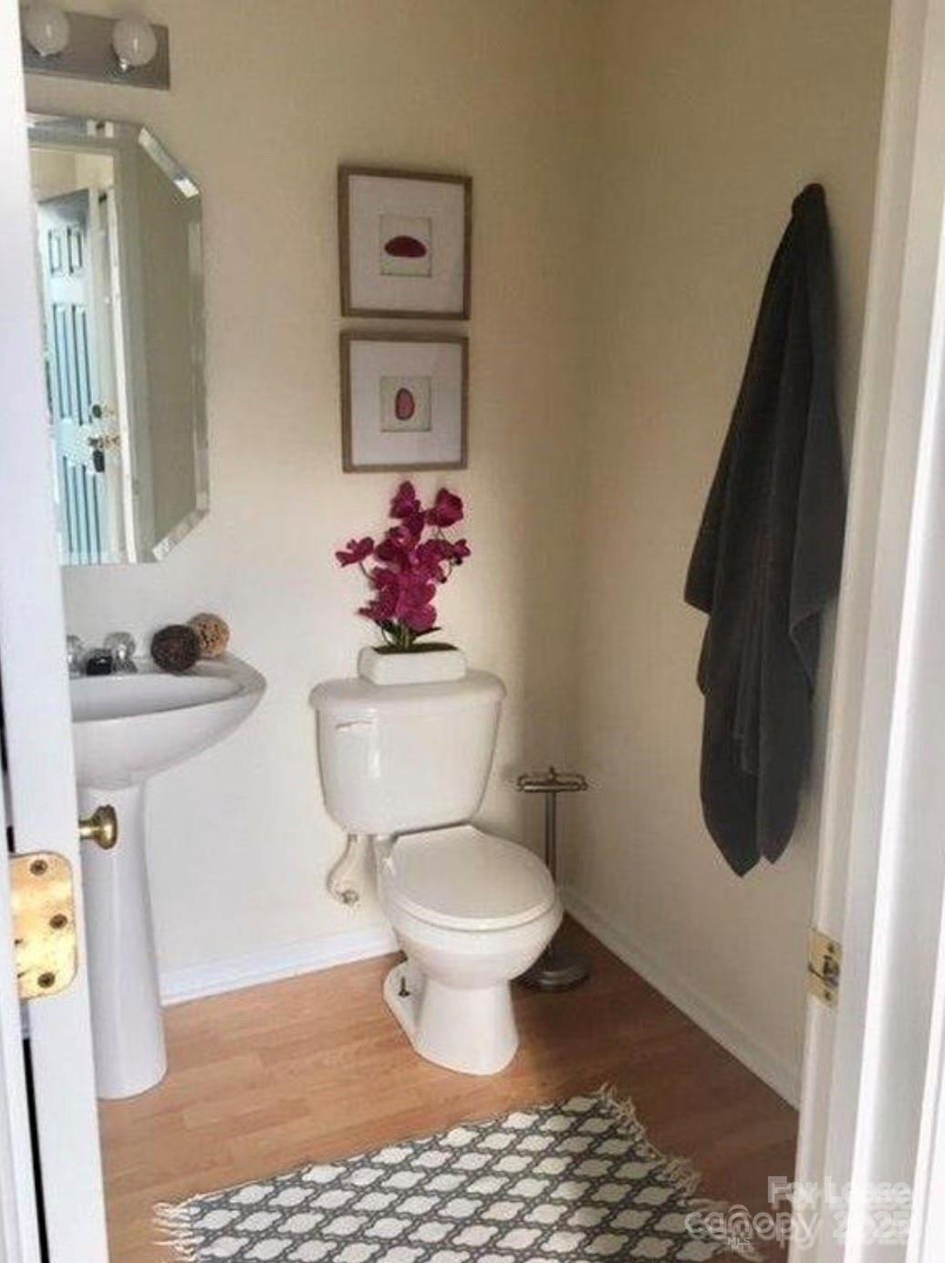 3232 Barons Court Road Charlotte, NC 28213 - Photo 5 of 11 a bathroom with a toilet and a sink