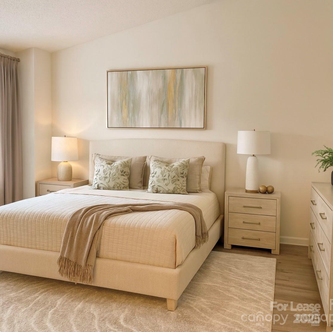3232 Barons Court Road Charlotte, NC 28213 - Photo 6 of 11 a bedroom with a bed and a night stand