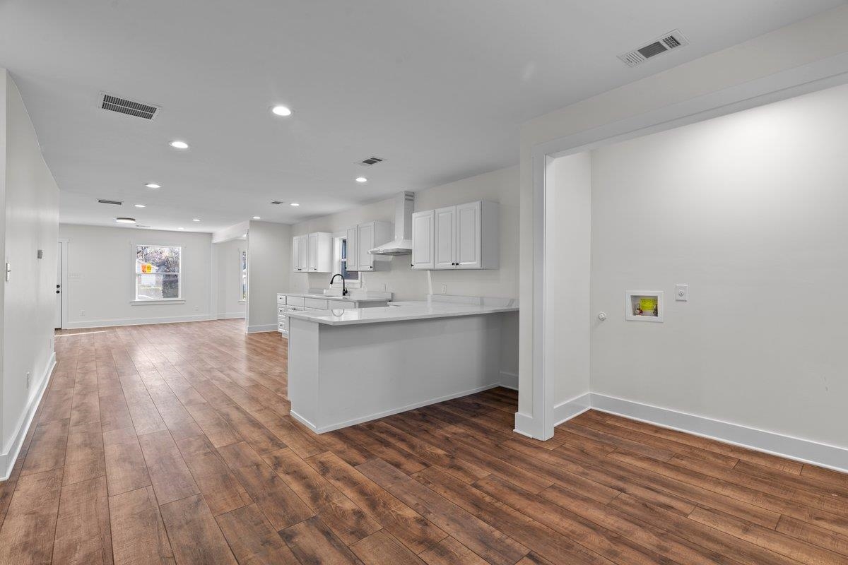 3220 Seminole Road Memphis, TN 38111 - Photo 23 of 23 Kitchen featuring white cabinets, a peninsula, dark wood-style floors, open floor plan, and recessed lighting