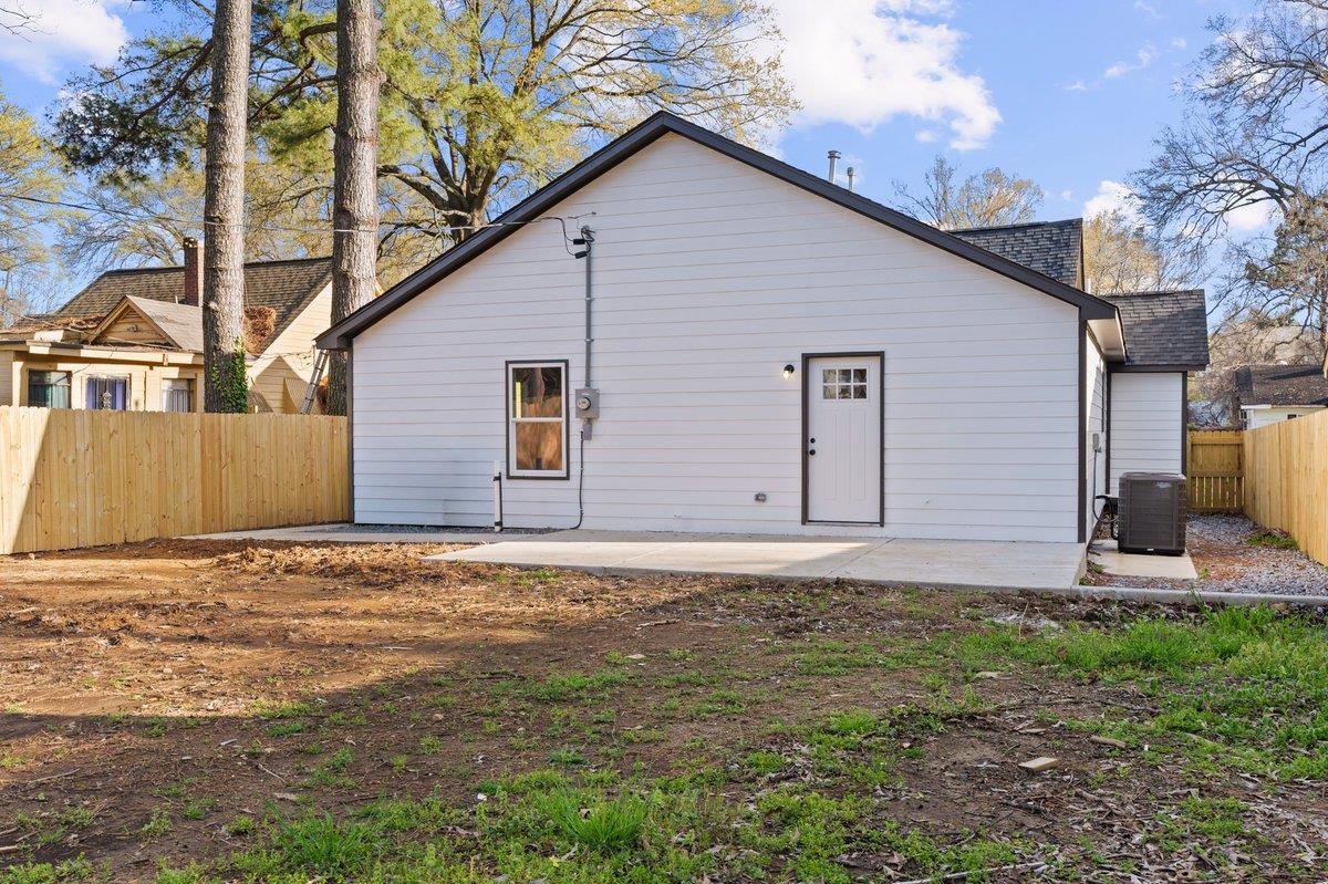 3220 Seminole Road Memphis, TN 38111 - Photo 21 of 23 Rear view of property featuring a shingled roof and a patio