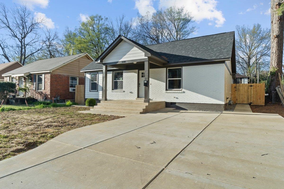 3220 Seminole Road Memphis, TN 38111 - Photo 3 of 23 Ranch-style home featuring brick siding, roof with shingles, and a porch