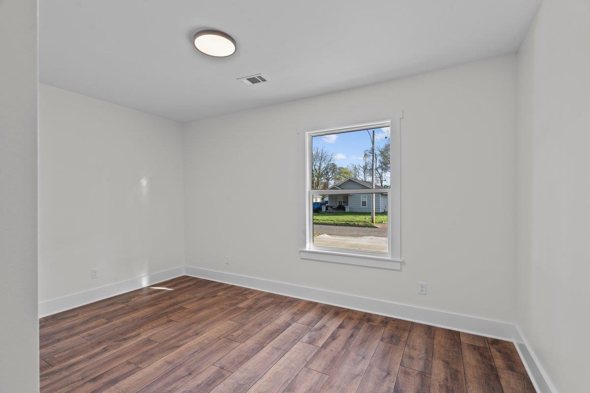 3220 Seminole Road Memphis, TN 38111 - Photo 6 of 23 Unfurnished room featuring dark wood finished floors and baseboards